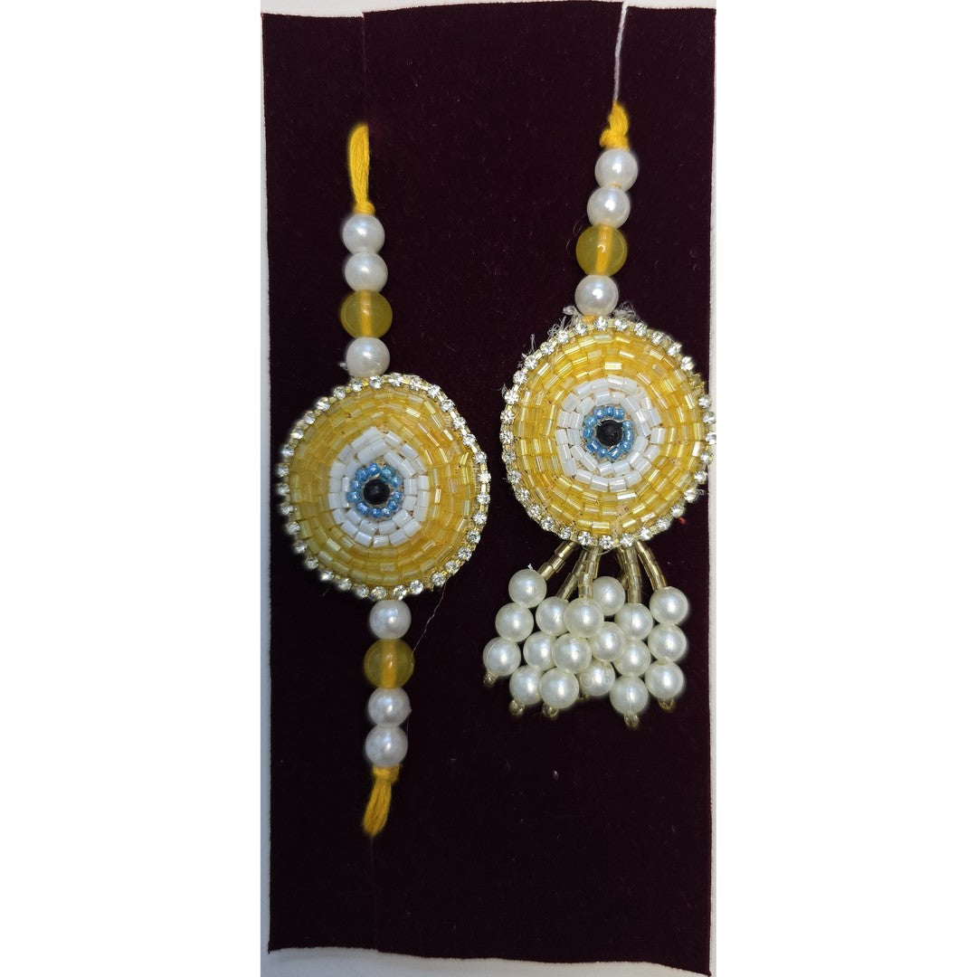 Golden beaded evil eye rakhi and lumba set close up Divine Sansar