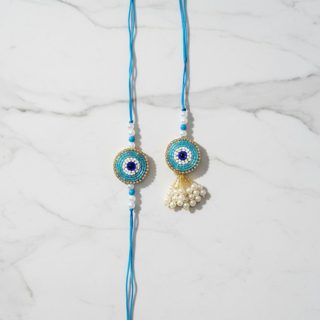 Drishti Jodi Firoza Turquoise Evil Eye Bhaiya Bhabhi Rakhi Set on marble - Divine Sansar UAE