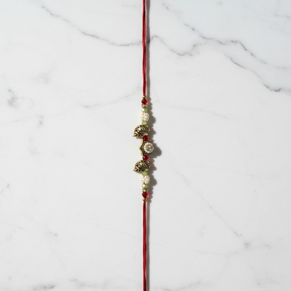 Gaja Sri Gold Elephant Rakhi on marble - Divine Sansar UAE