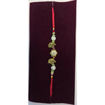 Gold elephant motif rakhi close up Divine Sansar