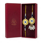 Yellow evil eye bhaiya bhabhi rakhi and lumba set in maroon gift box - Divine Sansar