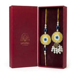Yellow evil eye bhaiya bhabhi rakhi and lumba set in maroon gift box - Divine Sansar