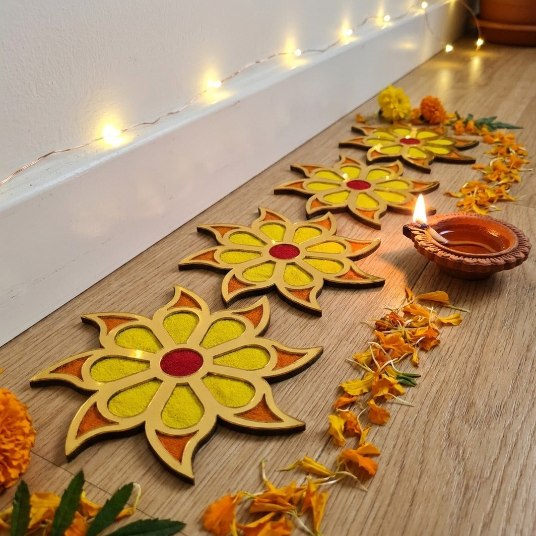 Set of 4 Surya Flower 4 inch golden rangoli pieces laid along the wall in a Dubai home for Diwali - Divine Sansar