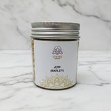 Jau (Jow) barley seeds for Navratri in a 90g jar on white marble - Divine Sansar