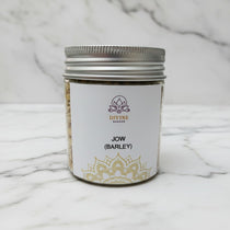 Jau (Jow) barley seeds for Navratri in a 90g jar on white marble - Divine Sansar
