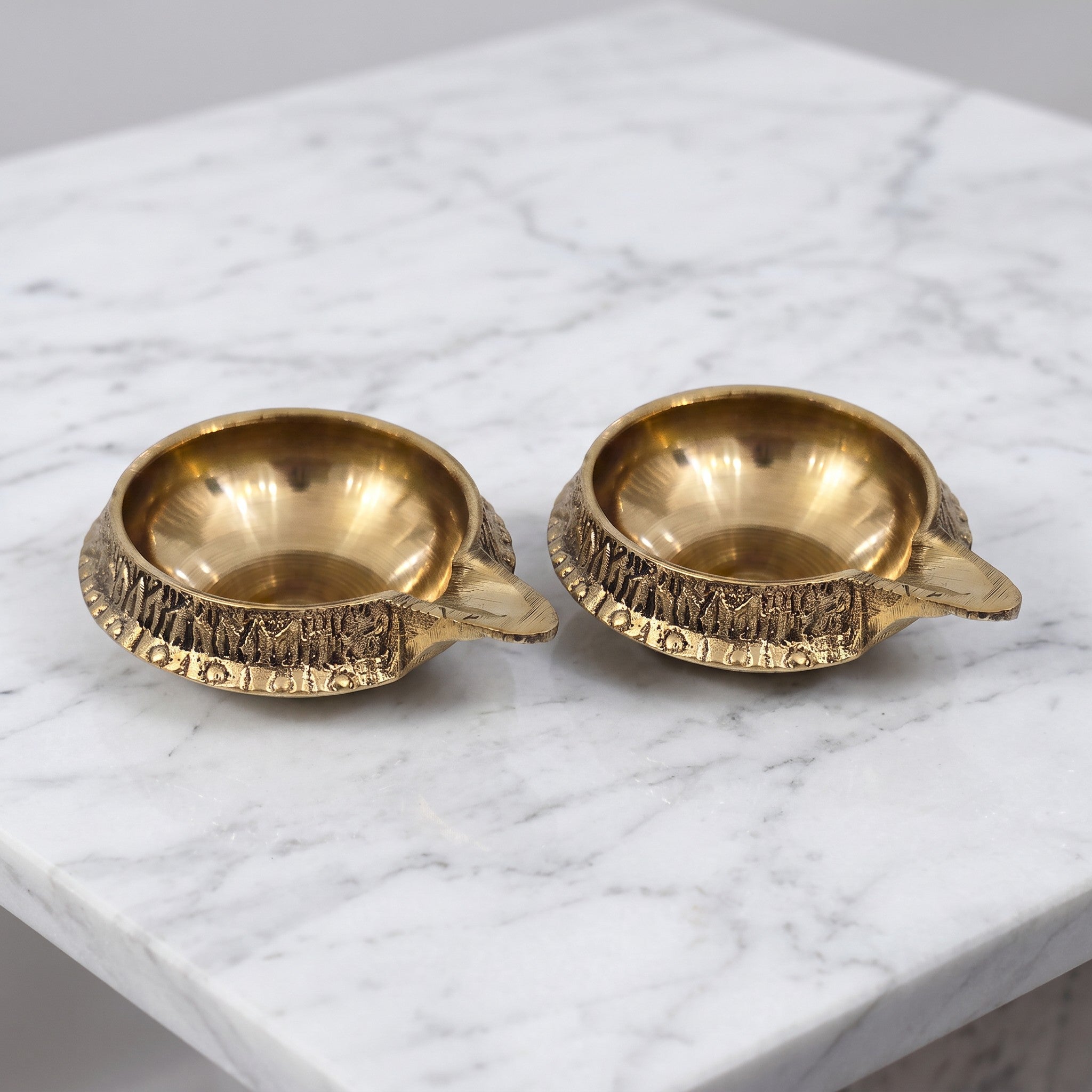 Brass Kuber Diya pair on white marble - Divine Sansar