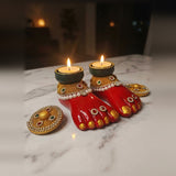 Laxmi Charan diya pair lit with tealights for Diwali, Divine Sansar
