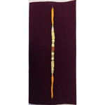Pearl and red stone rakhi close up Divine Sansar