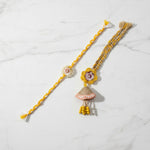 Marigold jhumka rakhi lumba set on marble - Divine Sansar
