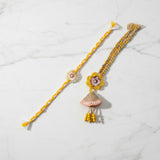 Marigold jhumka rakhi lumba set on marble - Divine Sansar