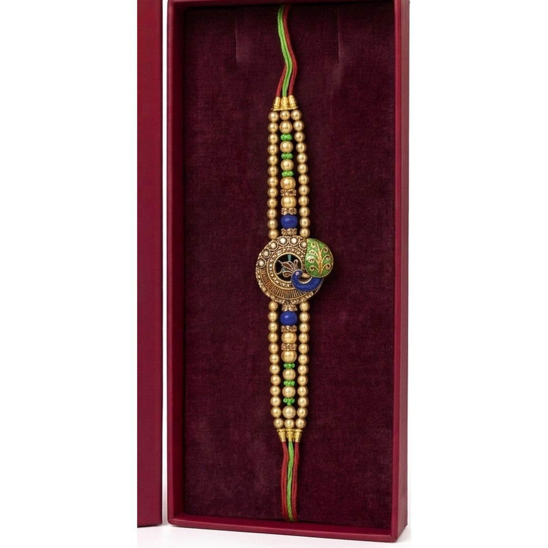Gold peacock meenakari rakhi close up Divine Sansar