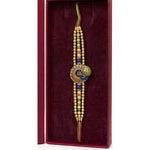 Gold peacock meenakari rakhi close up Divine Sansar