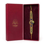 Mayura Tejas gold peacock meenakari rakhi in Divine Sansar gift box