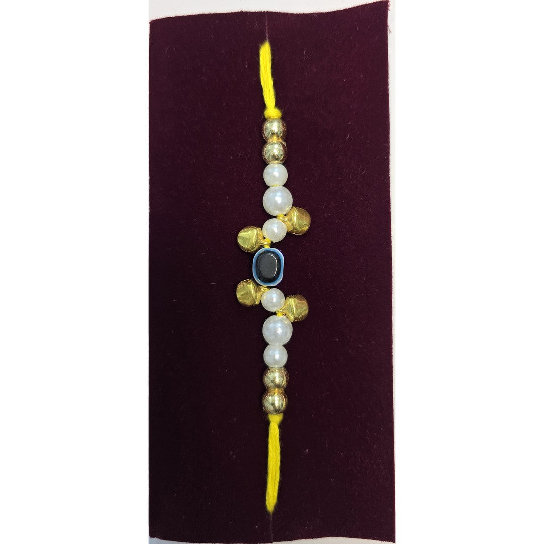 Pearl evil eye rakhi close up Divine Sansar