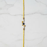 Moti Nazar Pearl Evil Eye Rakhi on marble - Divine Sansar UAE