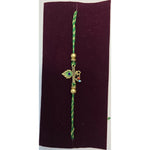 Krishna peacock feather Om rakhi close up Divine Sansar