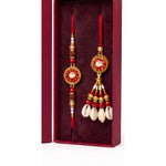 Red evil eye kauri rakhi and lumba set close up Divine Sansar