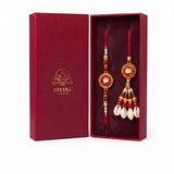 Nazar Kavach Laal red evil eye kauri bhaiya bhabhi rakhi set in Divine Sansar gift box