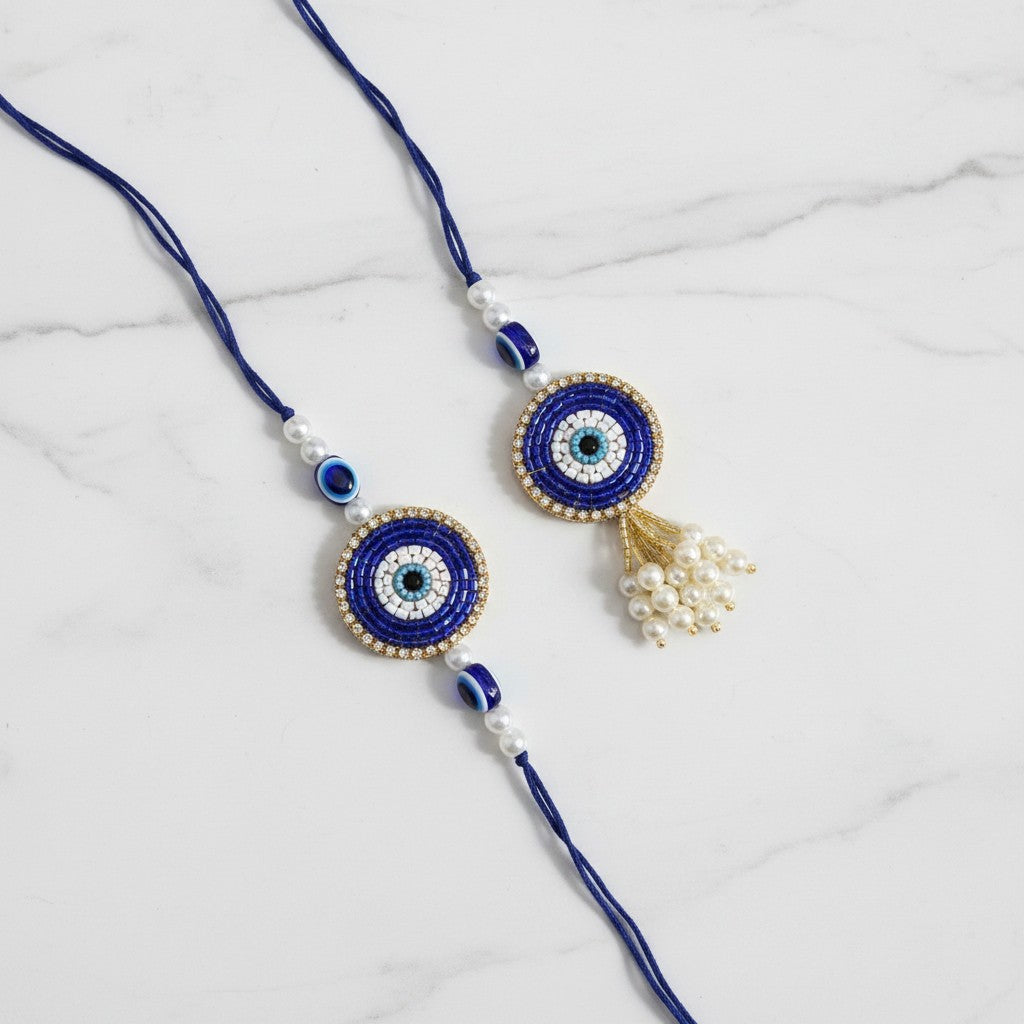 Drishti Jodi Neelam Sapphire Evil Eye Bhaiya Bhabhi Rakhi Set on marble - Divine Sansar UAE