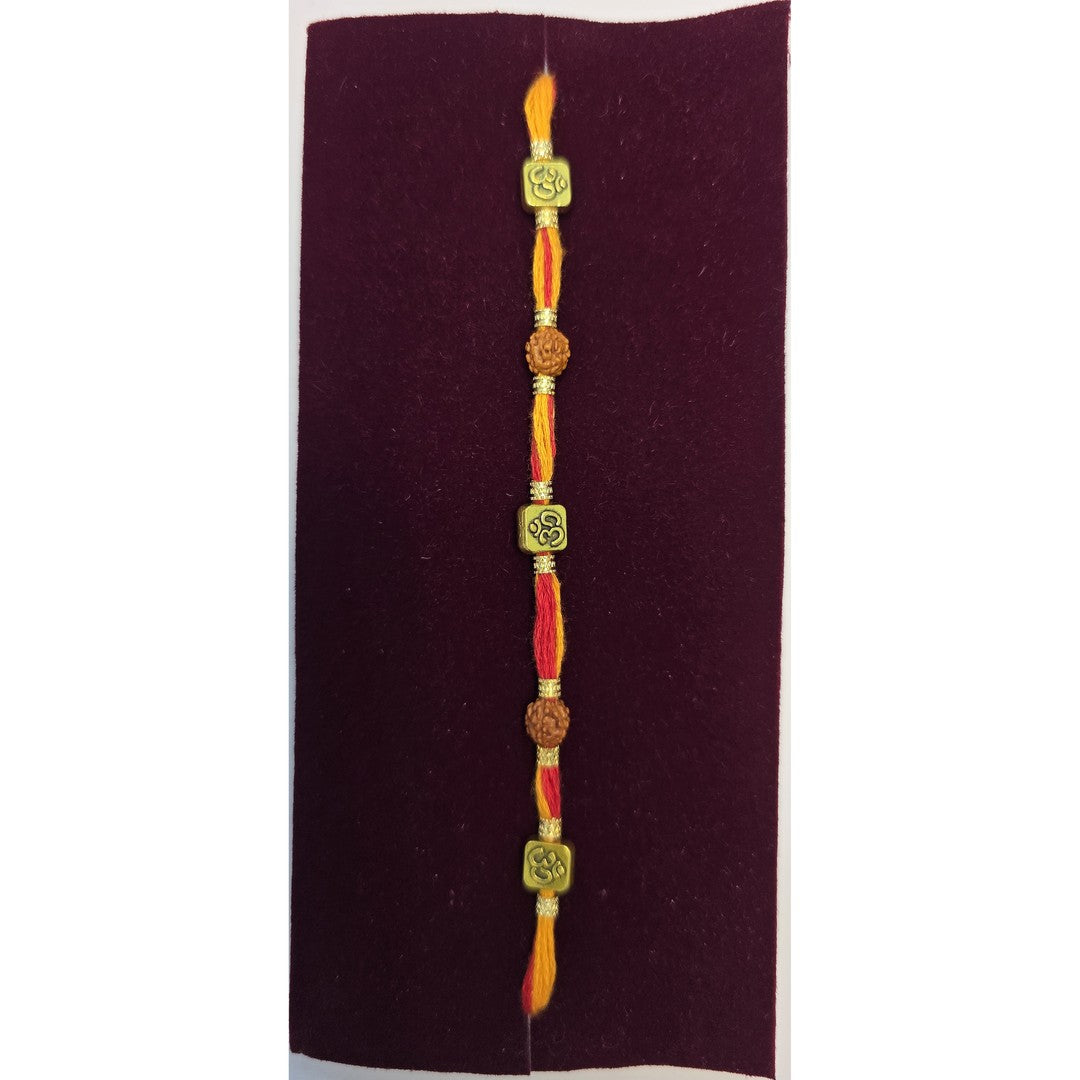 Om and rudraksha thread rakhi close up Divine Sansar
