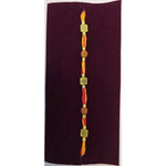 Om and rudraksha thread rakhi close up Divine Sansar