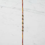 Om Rudra Sutra Om Rudraksha Rakhi on marble - Divine Sansar UAE