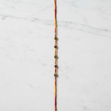 Om Rudra Sutra Om Rudraksha Rakhi on marble - Divine Sansar UAE