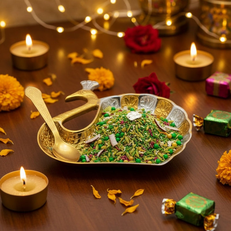 Peacock mukhwas bowl filled with saunf and mishri on a Diwali table with diyas - Divine Sansar
