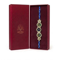 Peacock feather kundan rakhi in maroon gift box - Divine Sansar
