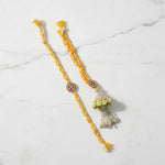 Kundan pearl jhumka rakhi lumba set on marble - Divine Sansar