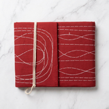Pooja Bahi Khata with red cloth cover and white hand stitching for Diwali Chopda Pujan - Divine Sansar