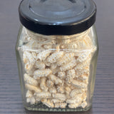 Divine Sansar-a square glass jar filled with puffed paddy