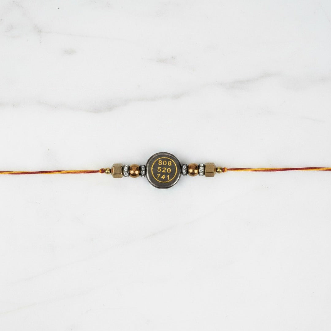 Two-sided pyrite prosperity rakhi on marble - Divine Sansar