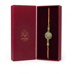 Pyrite rakhi Zibu abundance symbol side in maroon gift box - Divine Sansar