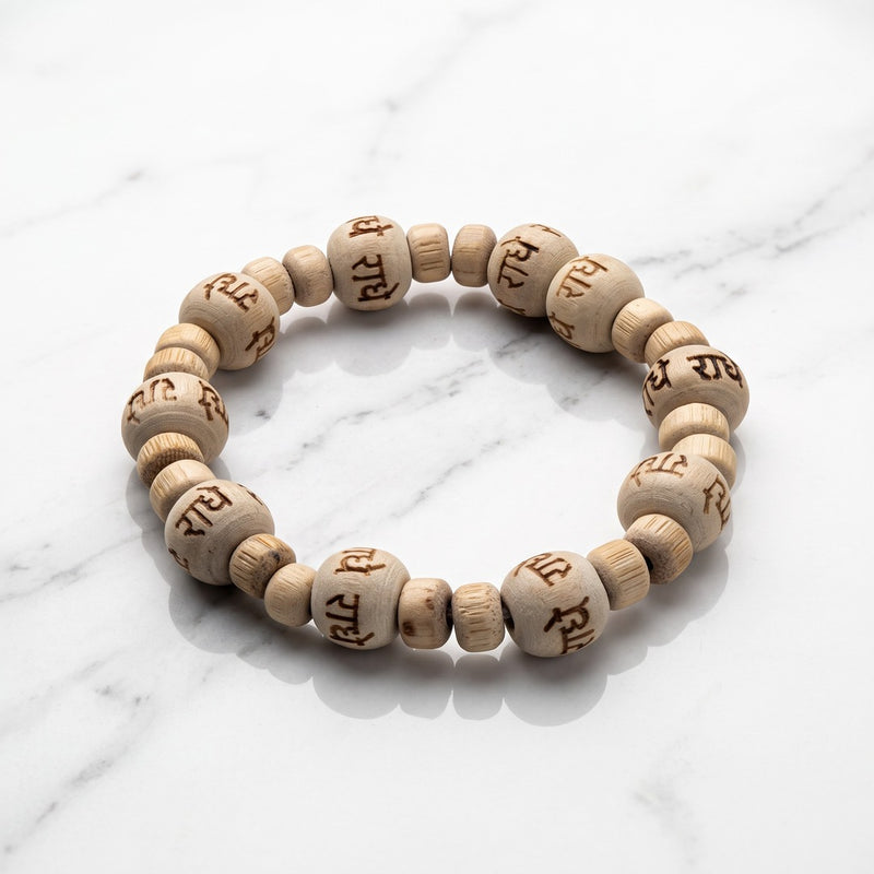 Natural tulsi (thulasi) wood bracelet engraved with Radhe on white marble - Divine Sansar