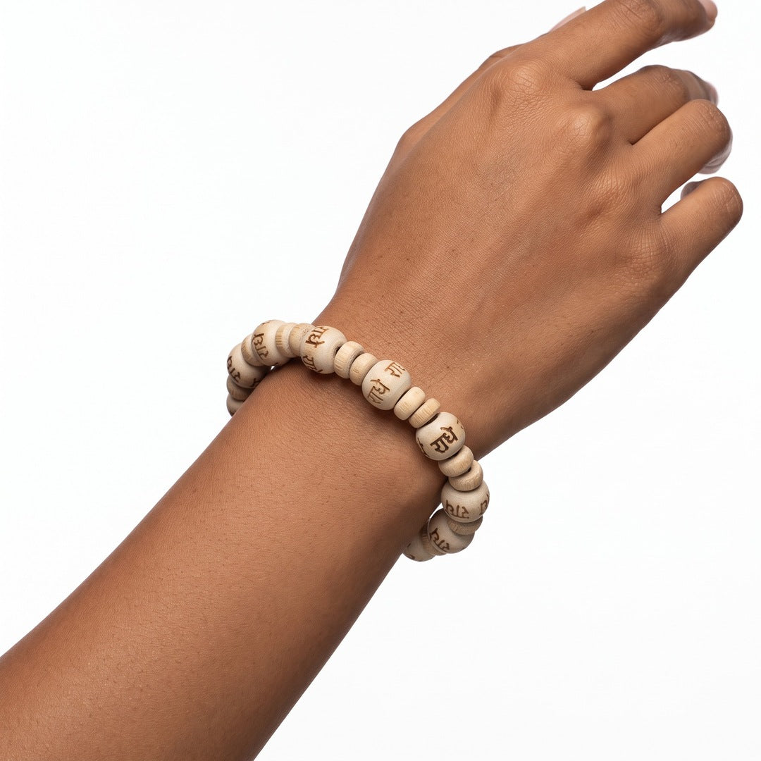 Radhe Tulsi Bracelet worn on the wrist, stretch fit tulsi wood beads - Divine Sansar
