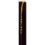 Rudraksha carved deity bead rakhi close up Divine Sansar