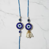 Sapphire blue evil eye rakhi lumba set on marble - Divine Sansar
