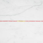 Saral Sutra Simple Beaded Rakhi on marble - Divine Sansar UAE