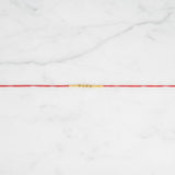 Saral Sutra Simple Beaded Rakhi on marble - Divine Sansar UAE