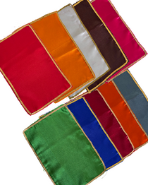 Divine Sansar-satin clothes of different colours with a white background