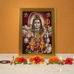 Shiv Parivar gold acrylic photo frame on a home mandir pooja setup with diyas and flowers - Divine Sansar