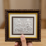 Silver Lakshmi Ganesh frame held in hand for size - Divine Sansar