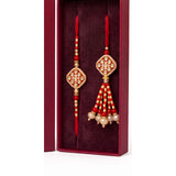 Red diamond meenakari rakhi and lumba set close up Divine Sansar