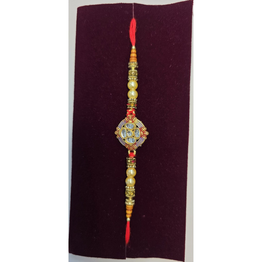 Diamond kundan rakhi with blue enamel close up Divine Sansar