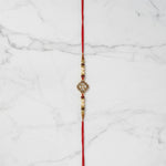 Suryamani Diamond Kundan Rakhi on marble - Divine Sansar UAE