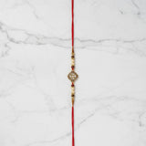 Suryamani Diamond Kundan Rakhi on marble - Divine Sansar UAE