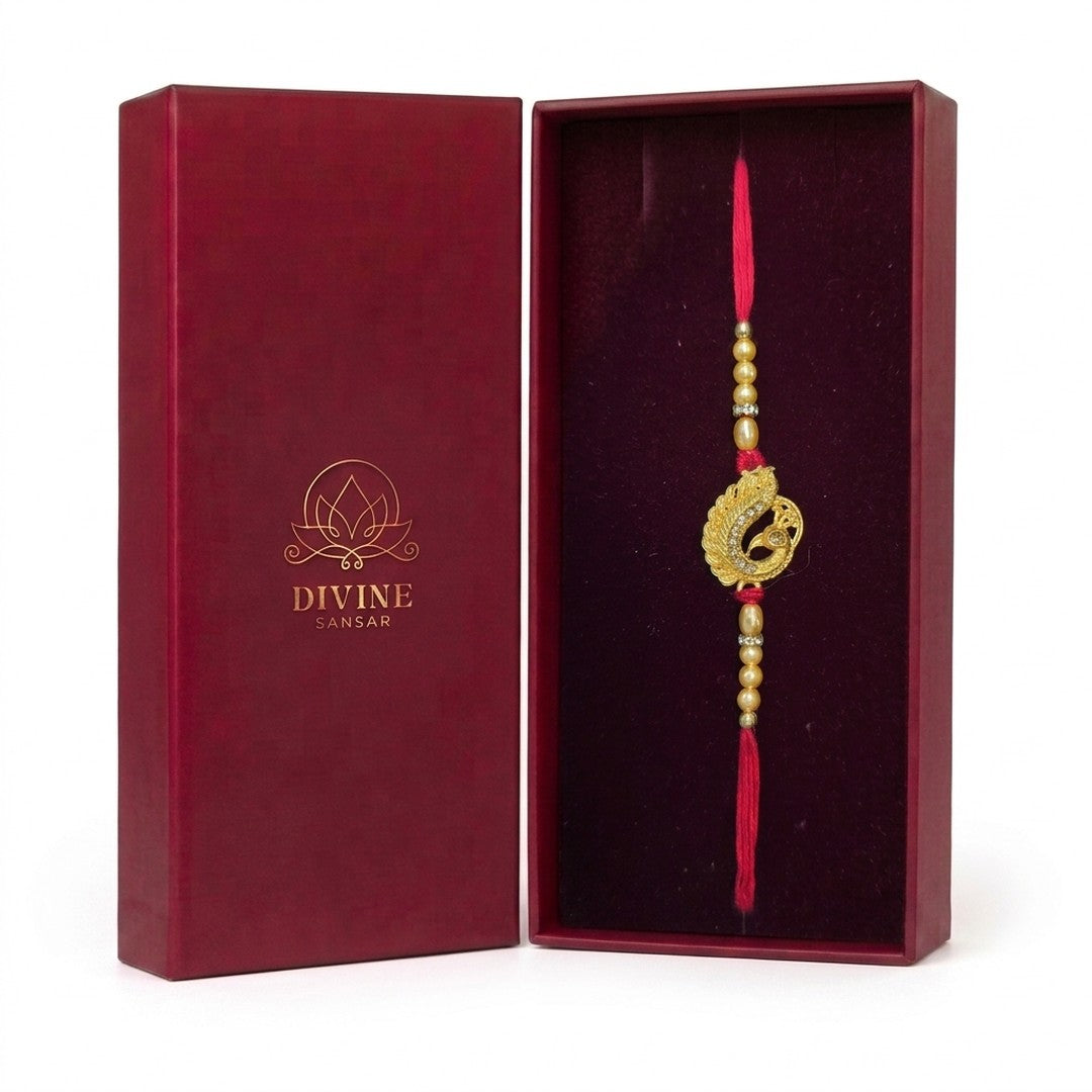 Swarna Mor gold peacock rakhi in Divine Sansar gift box