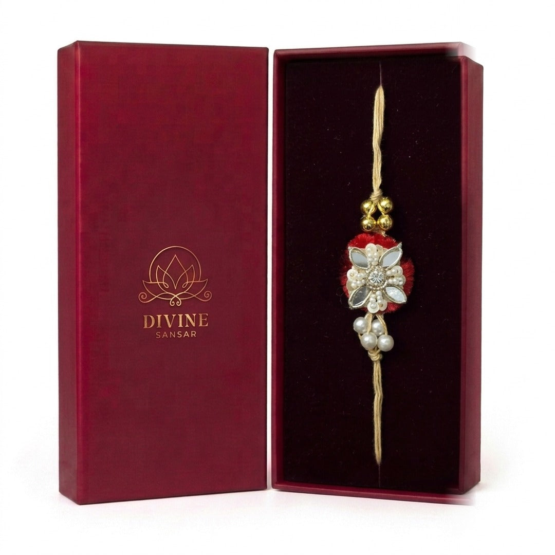Red velvet flower rakhi with pearls in maroon gift box - Divine Sansar
